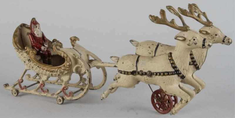 Appraisal: Cast Iron Hubley Santa Sleigh Toy Description American Two reindeer