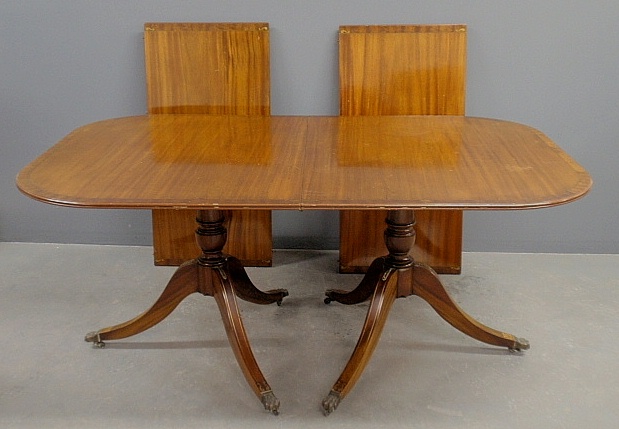 Appraisal: - English mahogany dining table with a double pedestal base