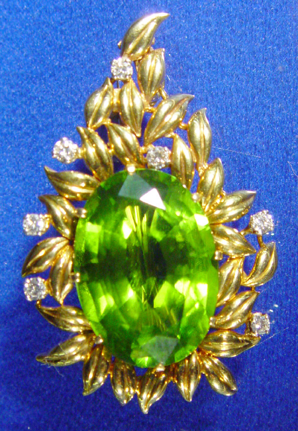 Appraisal: Gold diamond and green stone floral pendant