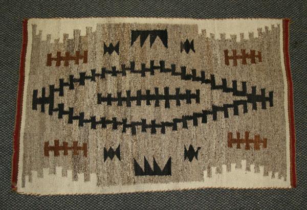 Appraisal: Navajo rug weaving hand loomed wool rug with central stylized