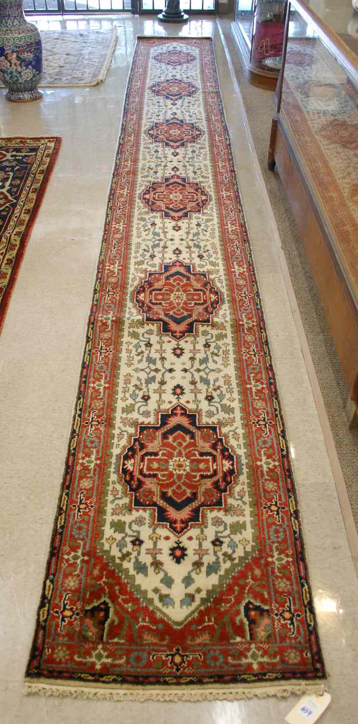 Appraisal: HAND KNOTTED ORIENTAL LONG RUG Persian Serapi design of repeating