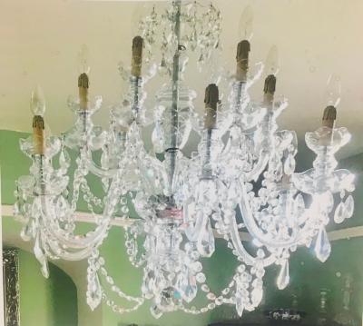 Appraisal: A twelve-branch cut glass chandelier with S-scroll arms hung cut