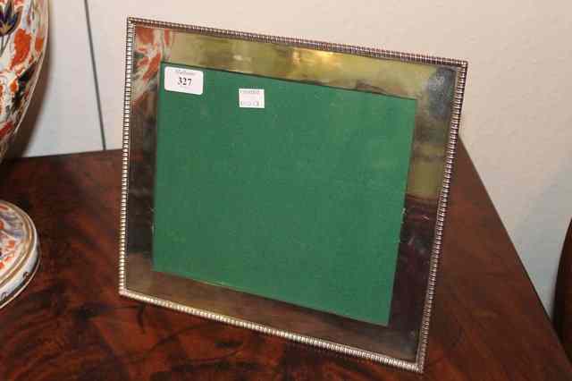 Appraisal: A SILVER PLATED RECTANGULAR PHOTOGRAPH FRAME with gadroon border x