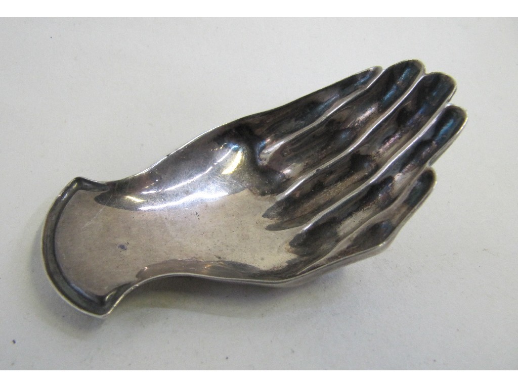 Appraisal: Silver caddy spoon modelled as an open hand Sheffield