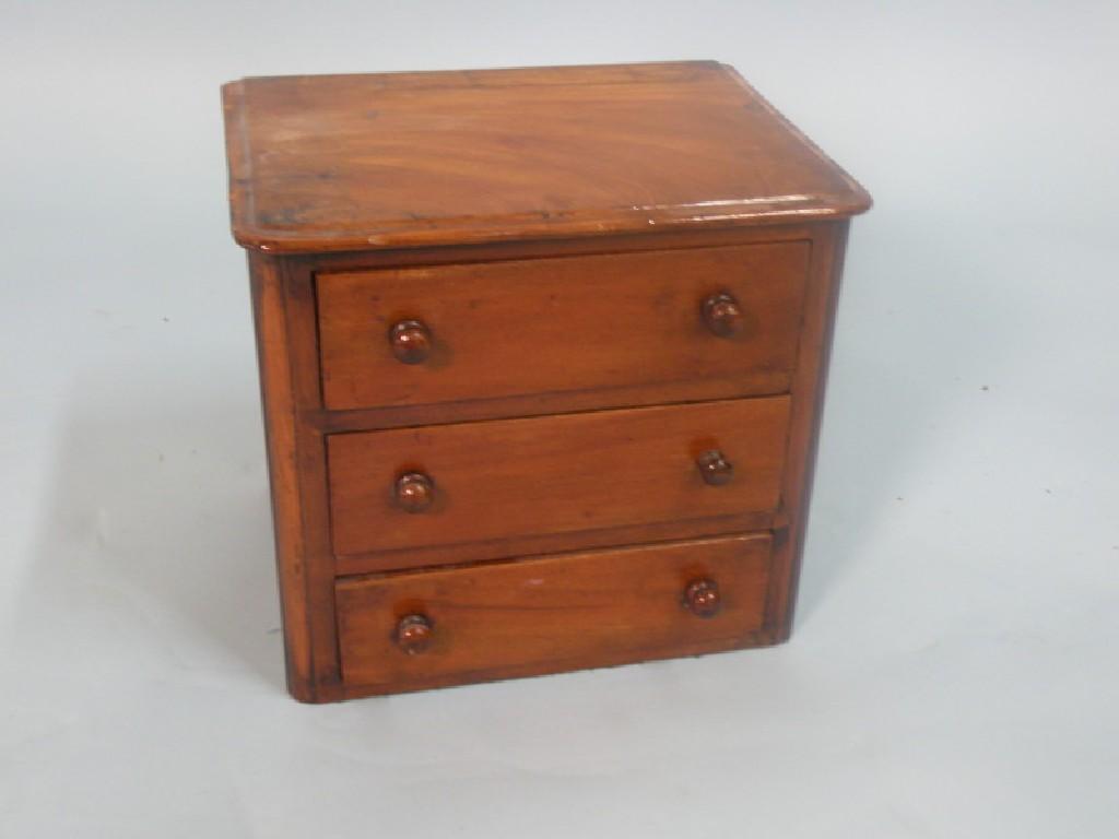 Appraisal: A Victorian mahogany miniature chest of three drawers cm wide