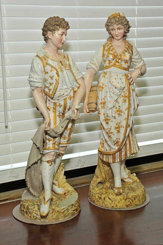 Appraisal: TWO LARGE PORCELAIN FIGURINES Male and female figures each in