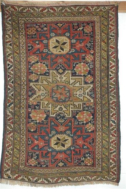 Appraisal: A KASAK MAT with polychrome geometric decoration and triple border