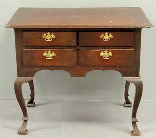 Appraisal: Mahogany lowboy late th c with a cut-corner top above