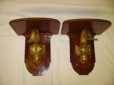 Appraisal: A PAIR OF MAHOGANY WALL BRACKETS the rounded oblong top