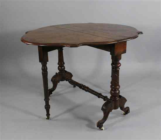 Appraisal: A Victorian burr walnut Sutherland table with shaped top on