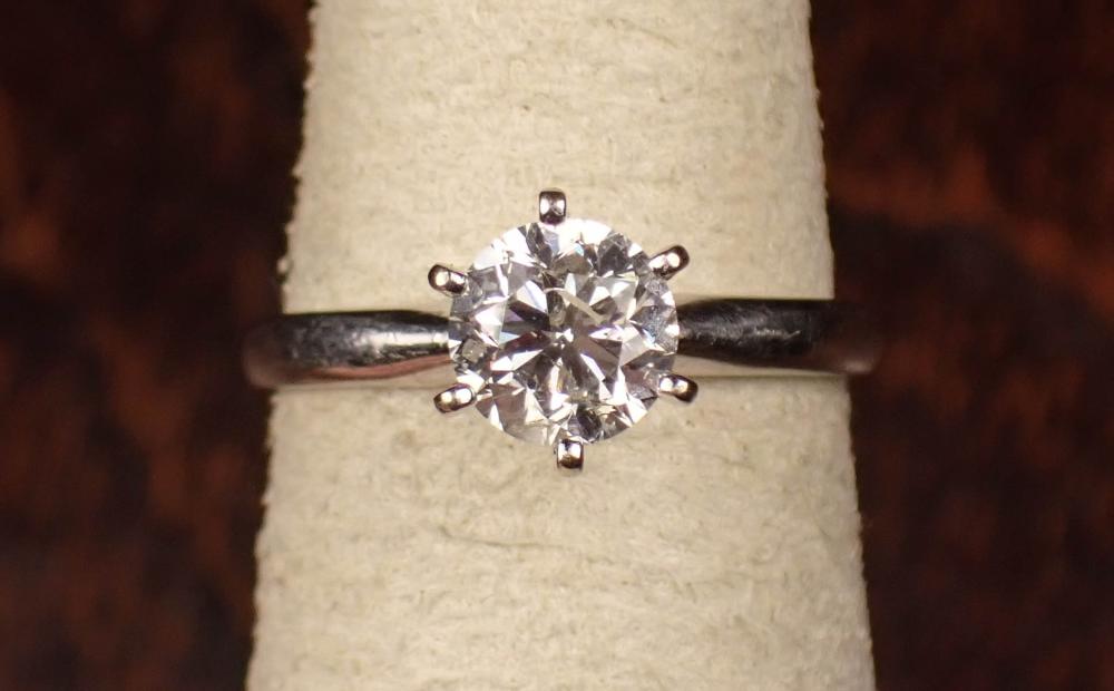 Appraisal: DIAMOND AND FOURTEEN KARAT GOLD SOLITAIRE RING with six white