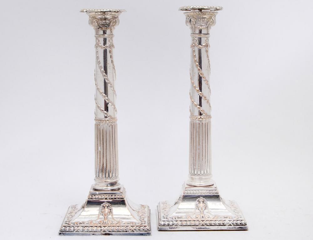 Appraisal: PAIR OF NEO-CLASSICAL STYLE SILVER PLATE CANDLESTICKS English nd Half