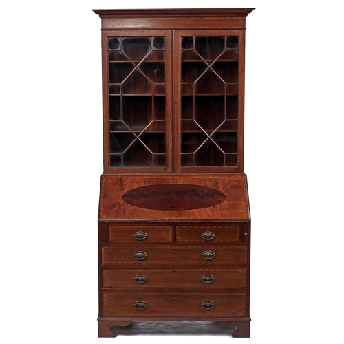 Appraisal: An Edwardian mahogany bureau-cabinet crossbanded in rosewood and line inlaid