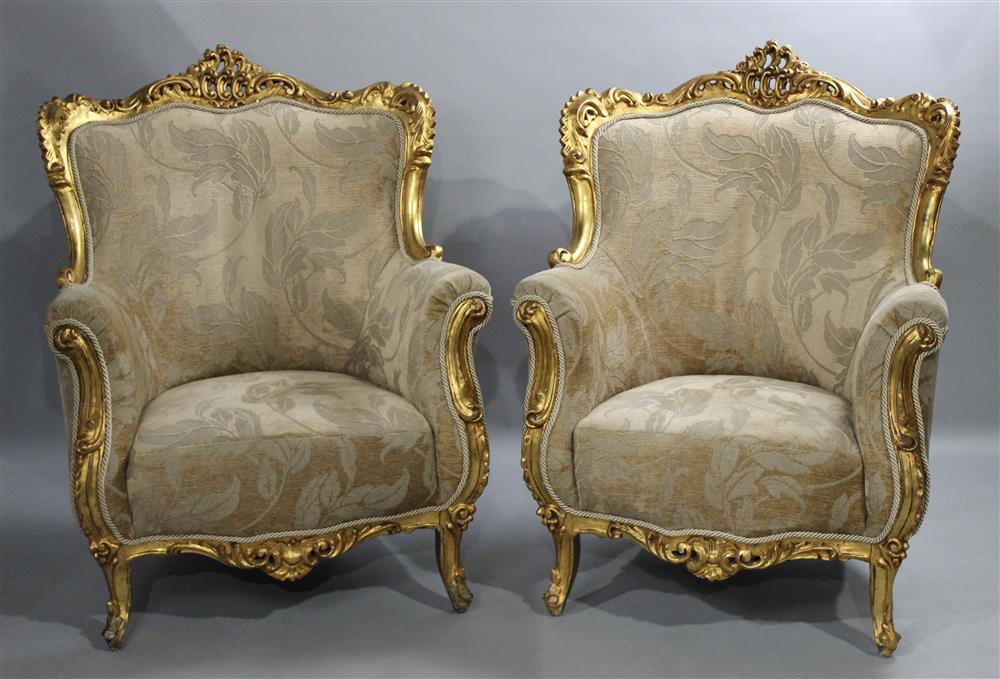 Appraisal: PAIR OF OVERSIZED CARVED AND GILDED LOUIS XV STYLE BERGERE