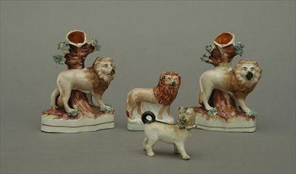 Appraisal: Pair of Staffordshire Pottery Lion Figure Spill Vases Together with