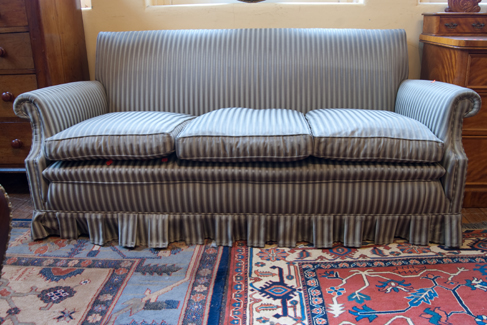 Appraisal: THREE SEATER STRIPPED UPHOLSTERED SOFA