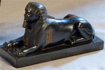 Appraisal: French Egyptian Revival bronze mixed patina model of a sphinx