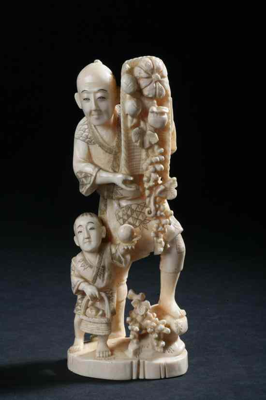 Appraisal: JAPANESE OKIMONO OF A MAN AND A CHILD Meiji Period