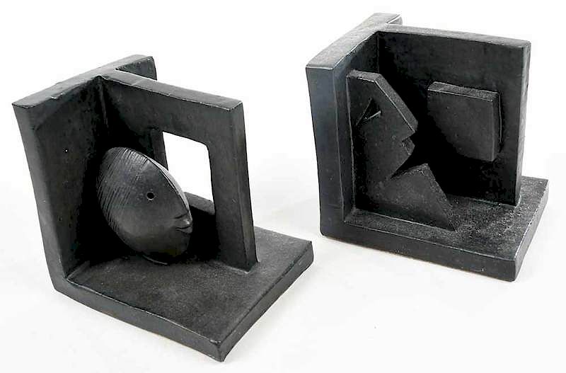 Appraisal: Two Glazed Art Pottery Figural Bookends geometric bookends with abstract