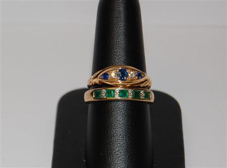 Appraisal: An emerald and diamond half eternity ring channel set to