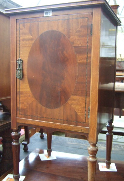 Appraisal: A late th century inlaid mahogany bedside cupboard the single