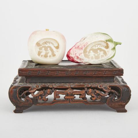 Appraisal: Two Interior-Carved Ivory Okimono of Fruit Early th Century Including