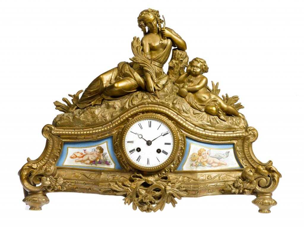 Appraisal: A NAPOLEON III GILT BRONZE MANTEL CLOCK surmounted by the