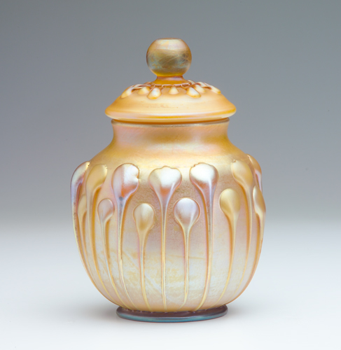 Appraisal: L C TIFFANY Gold Favrile glass covered jar with two