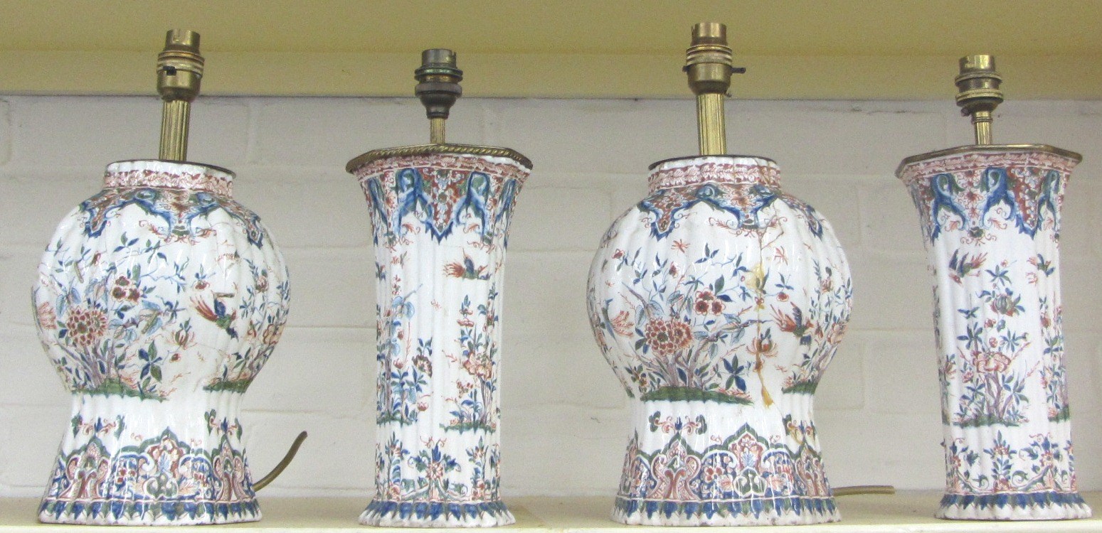 Appraisal: Two pairs of Continental faience polychrome vases mounted as lamps