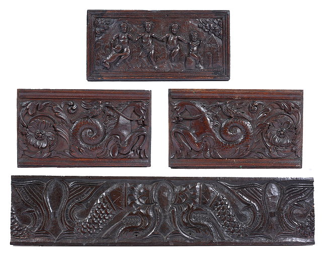 Appraisal: AN ANTIQUE CARVED OAK PANEL depicting cherubs dancing cm x