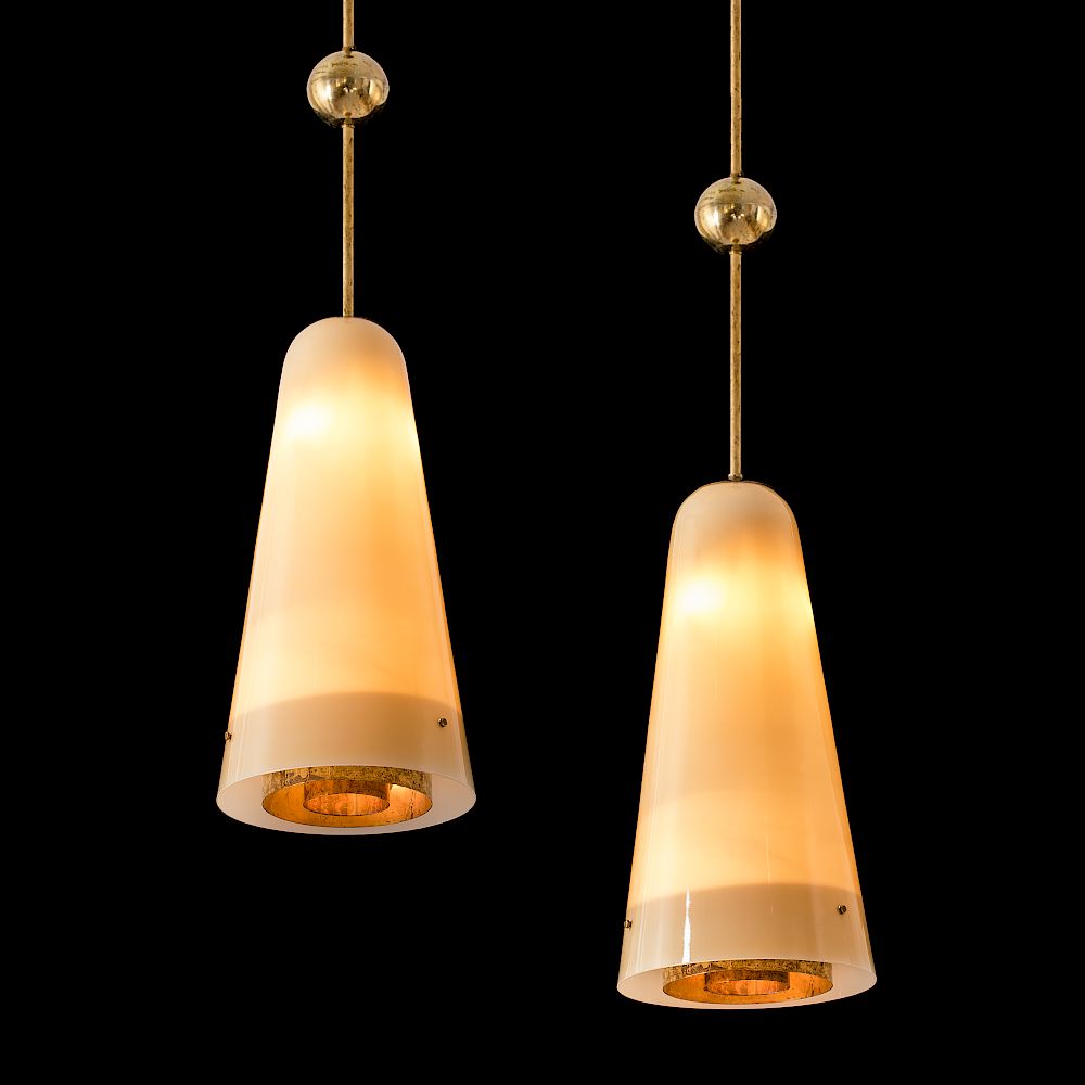 Appraisal: Paavo Tynell A pair of rare custom order ceiling lights