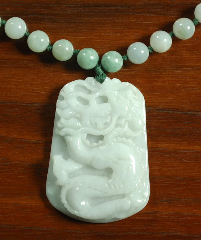 Appraisal: JADE PENDANT NECKLACE having beaded inch long necklace with dragon