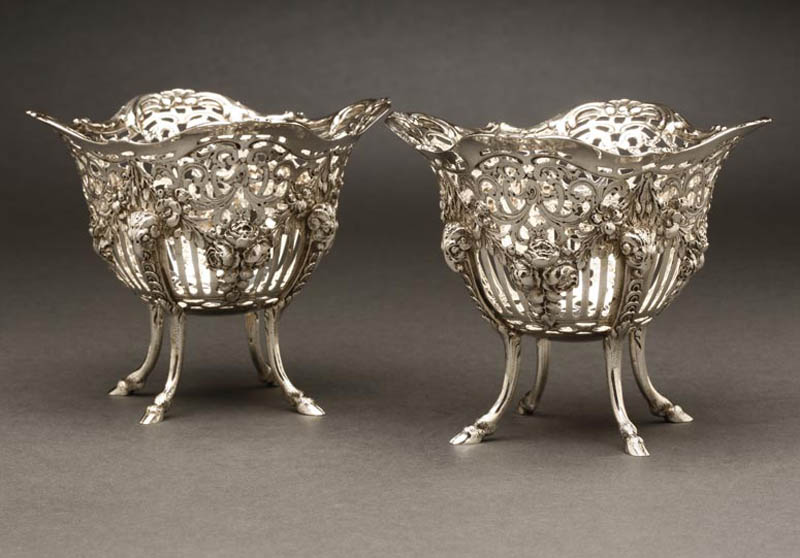 Appraisal: A pair of German silver pierced footed baskets A pair