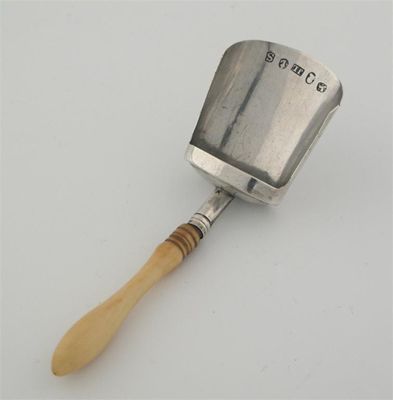 Appraisal: A George III caddy scoop with turned ivory handle by