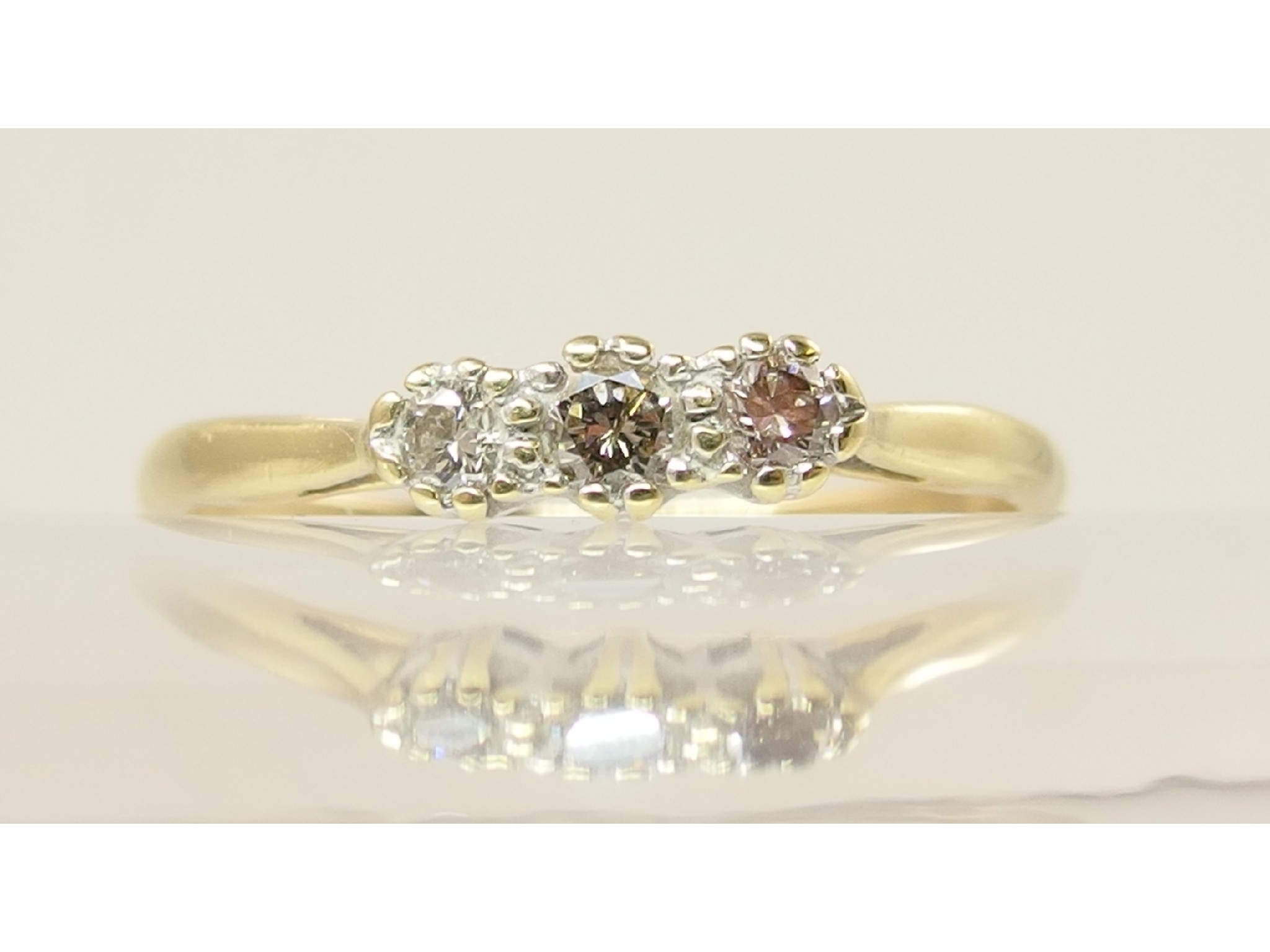 Appraisal: An ct three stone diamond ring by Compton Woodhouse of