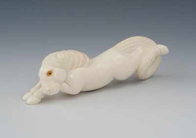 Appraisal: A Carved Ivory Netsuke of a Recumbent Horse Carved from