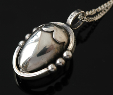 Appraisal: A silver pendant and chain by Georg Jensen The sterling