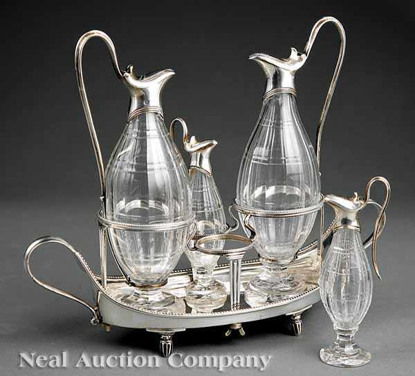 Appraisal: A George III Sterling Silver Cruet Stand John Schofield mark