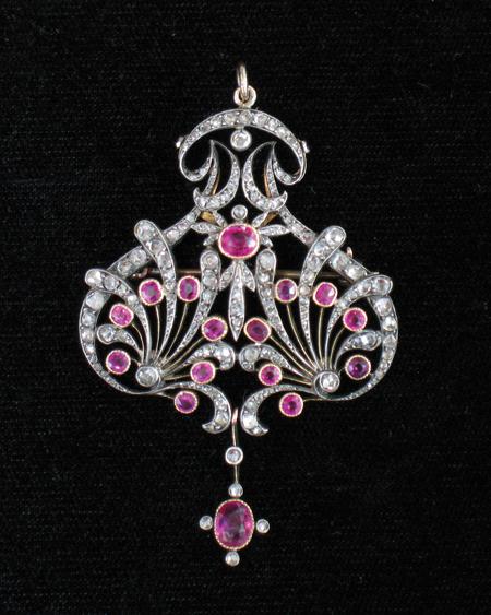 Appraisal: A BELLE EPOQUE RUBY AND DIAMOND BROOCH PENDANT of open