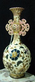 Appraisal: A Zsolnay Pecs bottle form vase with reticulated neck and