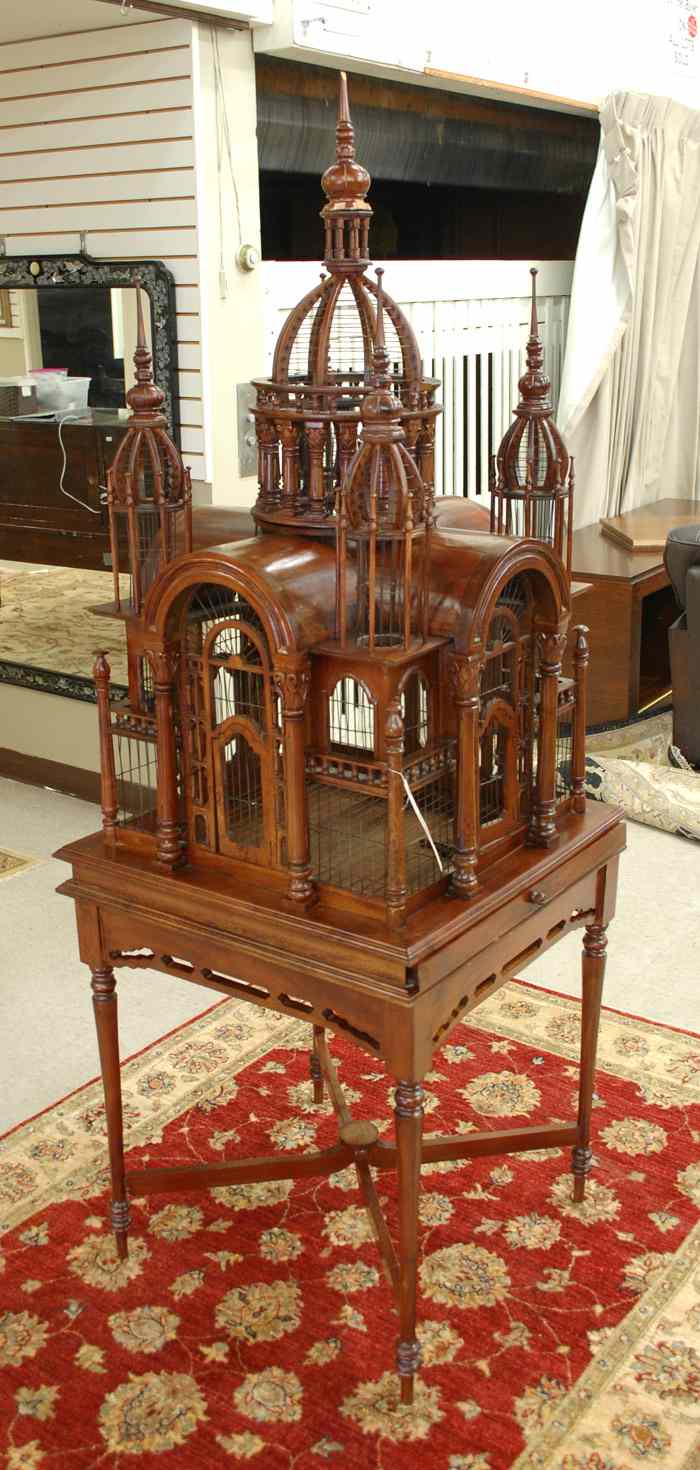 Appraisal: ARCHITECTURAL BIRDCAGE ON STAND American Aesthetic Movement influence the mahogany