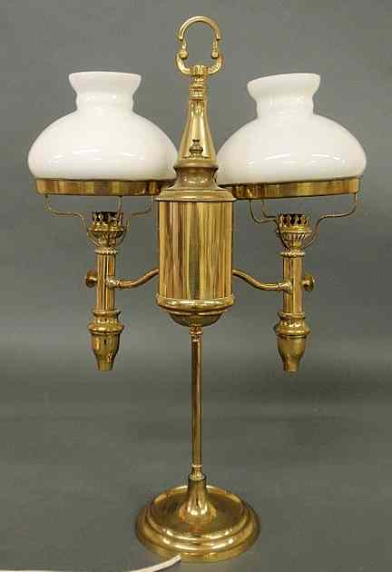 Appraisal: Brass double-arm student lamp converted to electricity with white glass