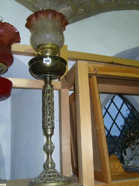 Appraisal: A tall brass oil lamp base with pierced column and