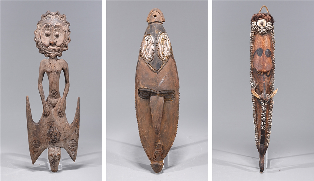 Appraisal: Group of three African tribal carvings including one with intricate