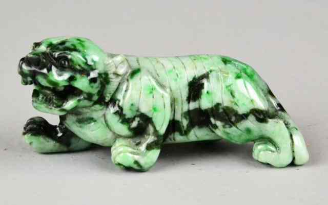 Appraisal: Chinese Carved Jadeite TigerBlack white green jadeite carved tiger ''