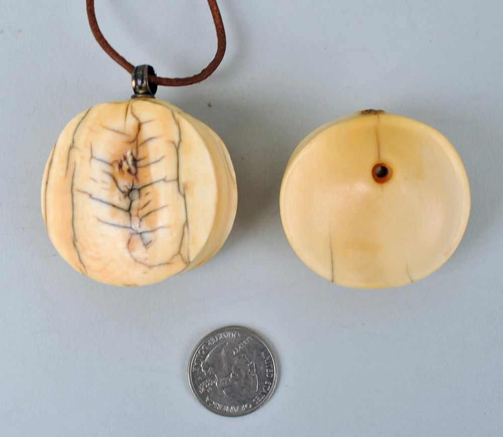 Appraisal: Two Antique African Ivory Turkana Lip Plugs one as necklace