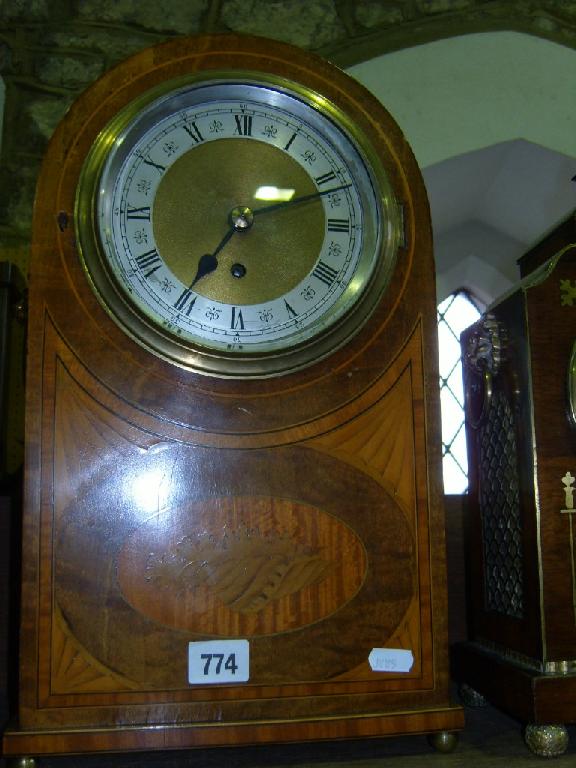 Appraisal: A substantial inlaid Edwardian mahogany mantle clock in a cigar