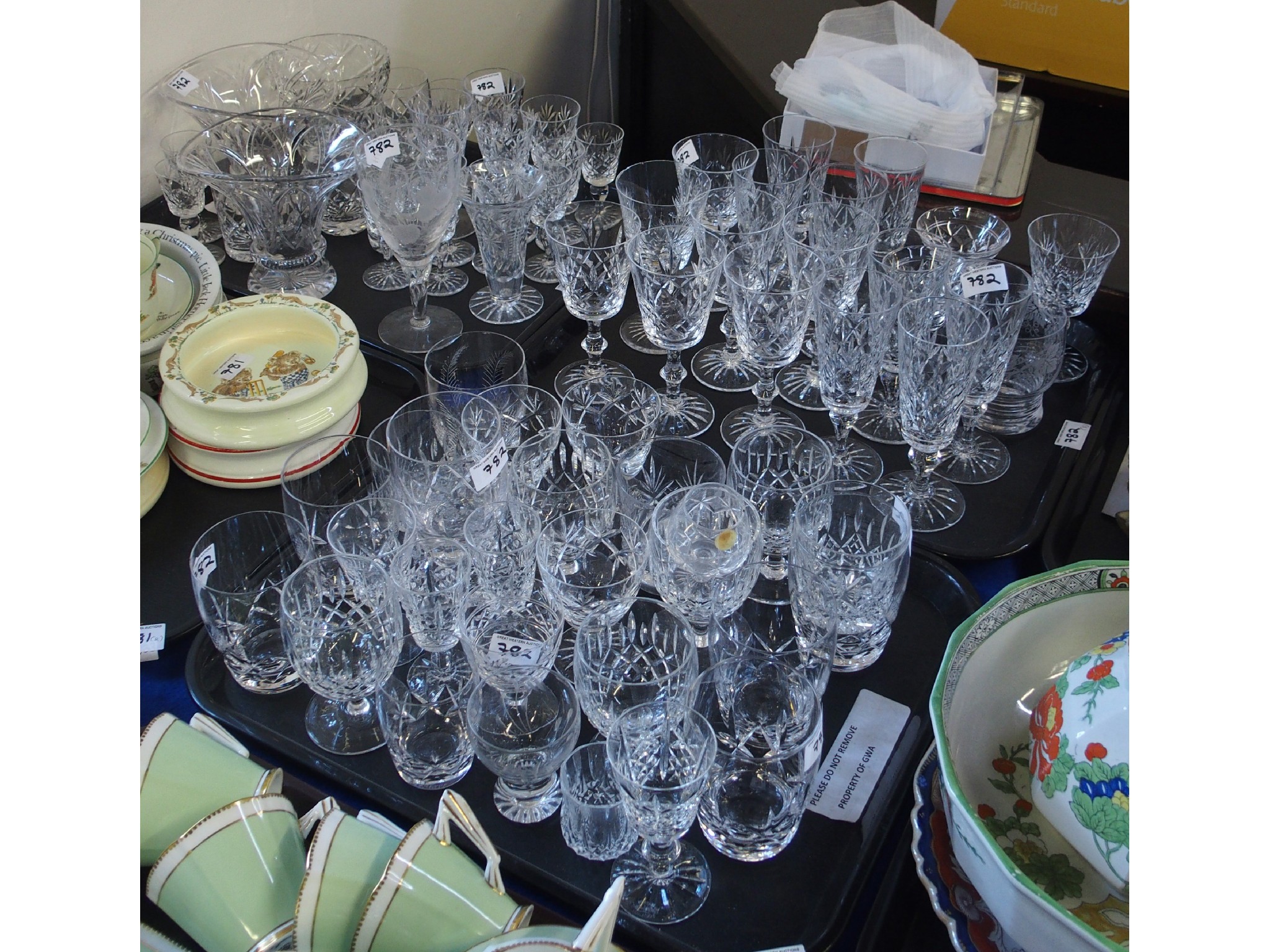 Appraisal: Three trays comprising cut glass stemware and vases