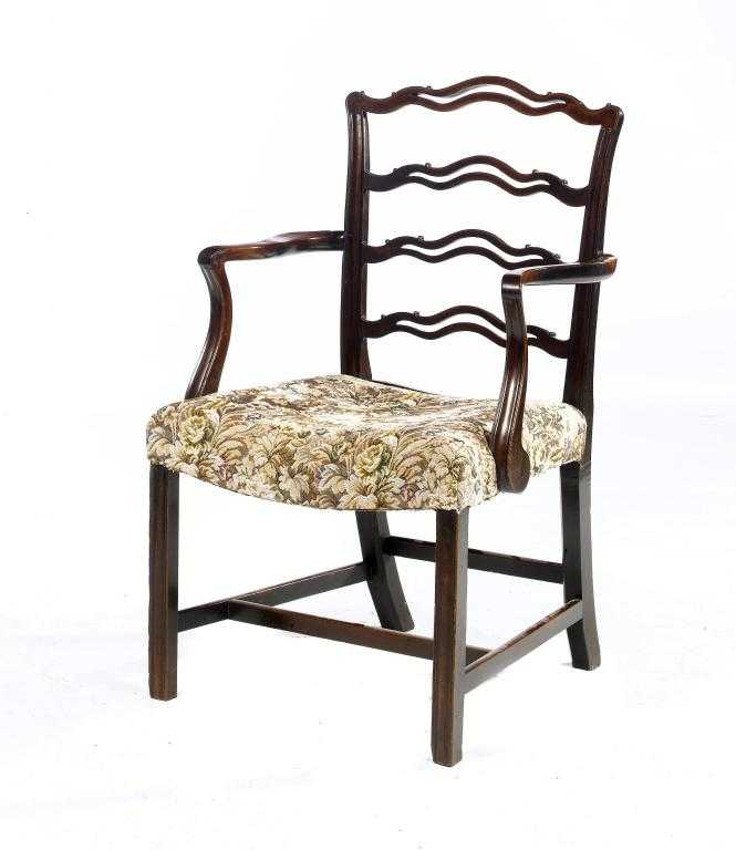 Appraisal: A GEORGE III MAHOGANY ELBOW CHAIR with pierced ladder back