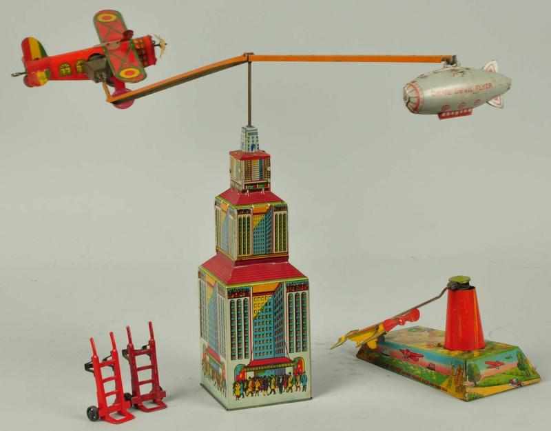 Appraisal: Lot of Tin Litho Marx Airplane Wind-Up Toys Description American